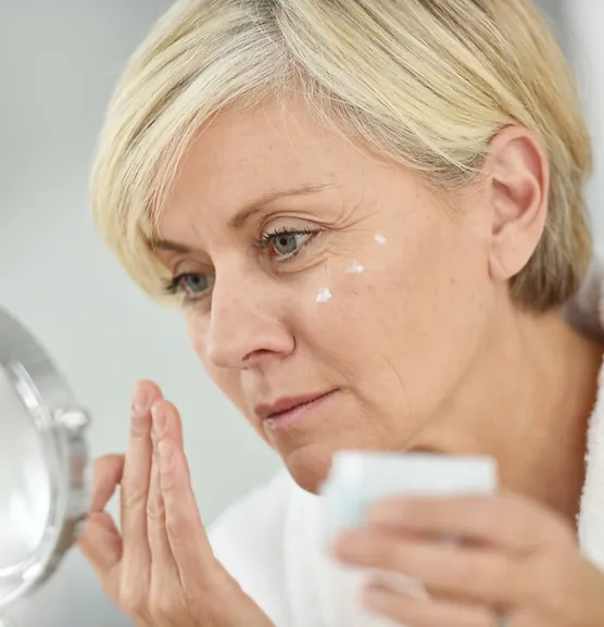 Woman Applying Face Cream